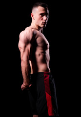 Fototapeta na wymiar Sporty muscular man isolated