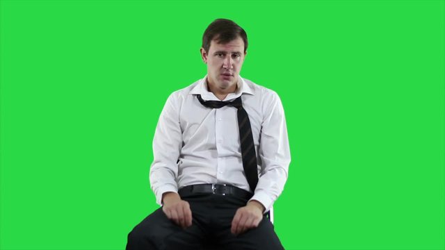 Falling asleep businessman on green screen. Short sleep at work.