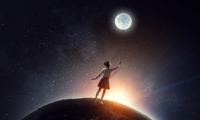 Obraz na płótnie Canvas Girl holds the moon . Mixed media