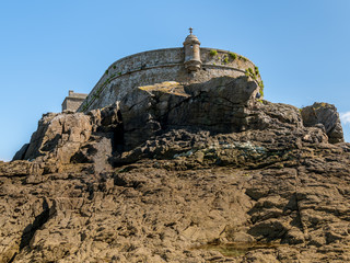 Fort on the island Petit-Be, Saint-Malo at low tide on a sunny day in summer