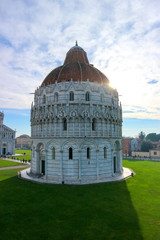 Amazing view to Pisa baptistery and piazza dei miracoli (square of miracles) in a sunny winter day, Tuscany, Italy