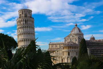 Amazing view from city wall to leaning tower of Pisa, symbol of Italy, and cathedral with green...