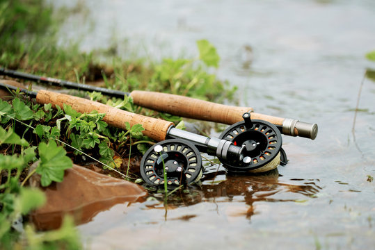 fly fishing rod with reel on the shore