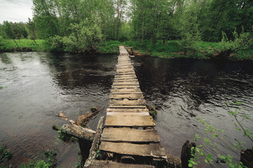 old wooden bridge over the river 
