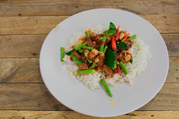 Rice topped with stir-fried crispy pork and basil