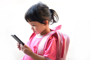 Fototapeta premium Children Playing Smartphone / child girl hold telephone in hand watching cartoons at the school