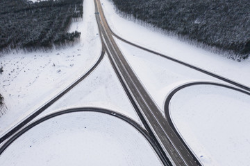 Winter snowy Highway with road junction view from above