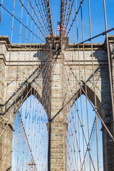 Details of the towers with the steel cables of the Brooklyn bridge in New York, United States