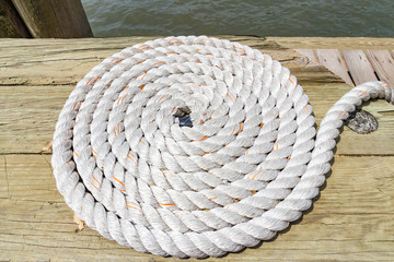 Coiled ship rope on the dock of Allis-Island, New York, United States