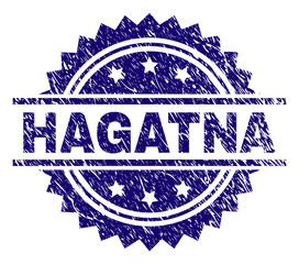 HAGATNA stamp seal watermark with distress style. Blue vector rubber print of HAGATNA caption with unclean texture.