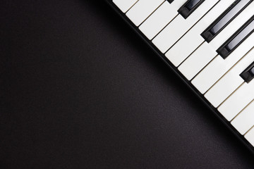 Piano keys on black background