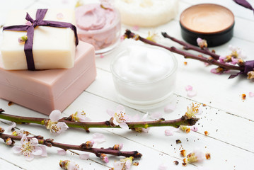 Beauty products and peach flowers