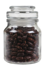 Glass jas of brown beans.
