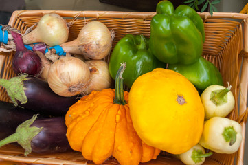 Autumn harvest: vegetables in a basket, zucchini, onions, eggplant, pepper, pumpkin