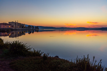 View of Orbetello in lagoon on peninsula Argentario at sunrise. Italy