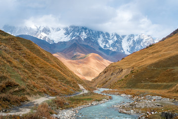 The valley of the Enguri river in autumn. The highest peak of Georgia is Shkhara. Main Caucasian ridge, Zemo Svaneti