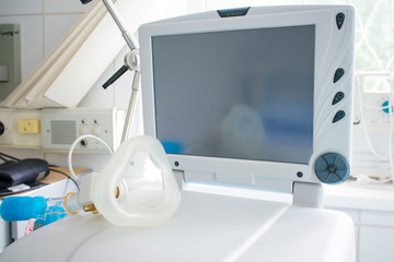 monitor of the ventilator and mask for artificial ventilation in the medical ward. concept of pandemic, coronavirus, virus, disinfection, panic.