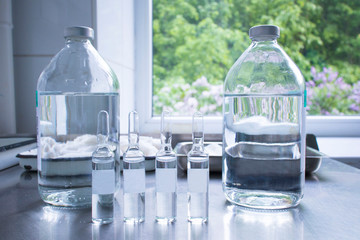vials and ampoules with medicine on the medical table