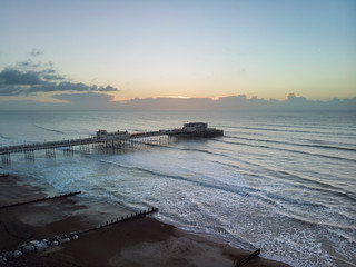 Fototapeta na wymiar Drone aerial view landscape image of Worthing pier on Sussex coast in England at dawn