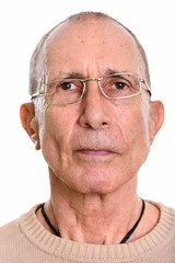 Face of senior man wearing eyeglasses isolated against white background