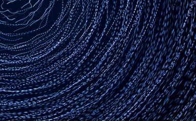 Blue lights in motion at night as an abstract background