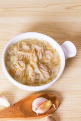 Homemade simple soup in white mug