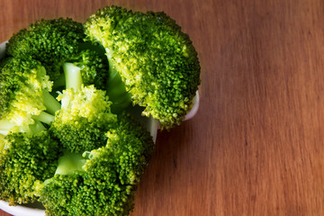 Cooked green broccoli with  salt and copyspace
