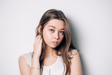 Fototapeta premium Beautiful smiling woman with clean skin, natural make-up on white background