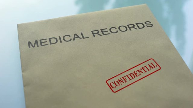 Medical Records Confidential, Stamping Seal On Folder With Important Documents