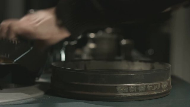 Archive film reel loading sequence in old film editing equipment