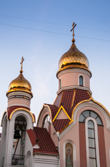 Fototapeta na wymiar Russia, Vladivostok, July 2018: Golden domes. Church of the Holy Spirit Igor Chernigov
