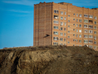 Apartment building. Blue Sky. Rocky Cliff. Ust-Kamenogorsk (Kazakhstan)