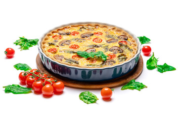 Baked homemade quiche pie in ceramic baking form