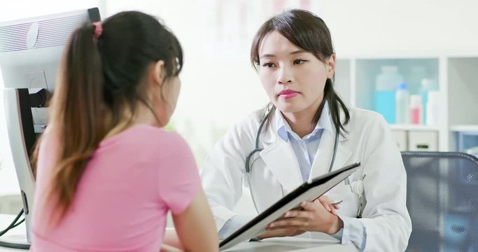 woman doctor and patient discussing