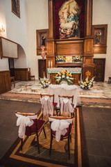 An ancient church is decorated to the wedding
