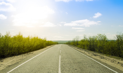 Summer road with the sun shining