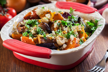 Roasted vegetables with rice in casserole dish