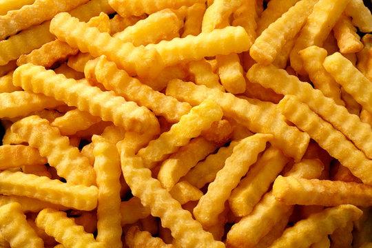 Full frame rippled fries in overhead view