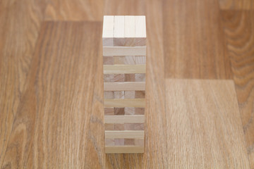 Wood block tower game on white background