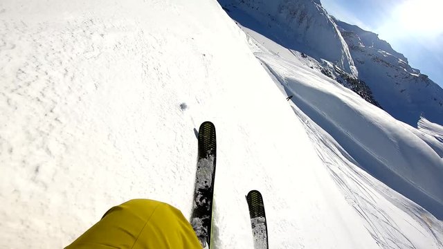 winter freeride skiing in powder fresh snow in alps on sunny day gopro chest mount