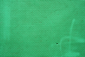 old and dirty green foam or rubber floor and soft board on top view for baby or children protect...
