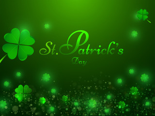 Stylish lettering of St. Patrick's Day on shamrock leaves decorated green background. Poster or banner design.