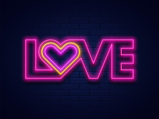 Love typography with neon lighting effect on blue brick wall background for valentine's day celebration concept.