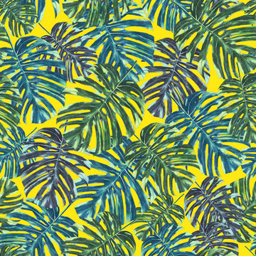 Seamless tropical monstera leaves and flowers pattern, jungle print design. Pattern on yellow background. Fashion trended tropical background.
