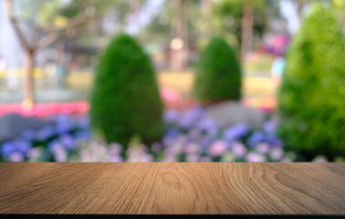 Empty dark wooden table in front of abstract blurred bokeh background of restaurant . can be used for display or montage your products.Mock up for space.