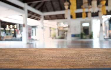 Empty dark wooden table in front of abstract blurred bokeh background of restaurant . can be used for display or montage your products.Mock up for space.