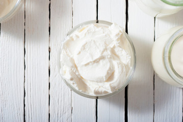 yogurt on white wooden table background