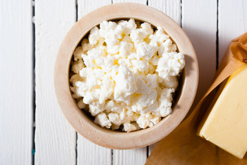 homemade dairy product samples on white wood table background