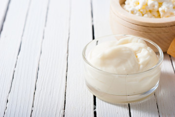 creme fraiche on white wood table background