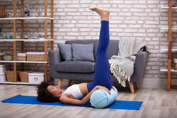 Woman Doing Leg Up Exercise